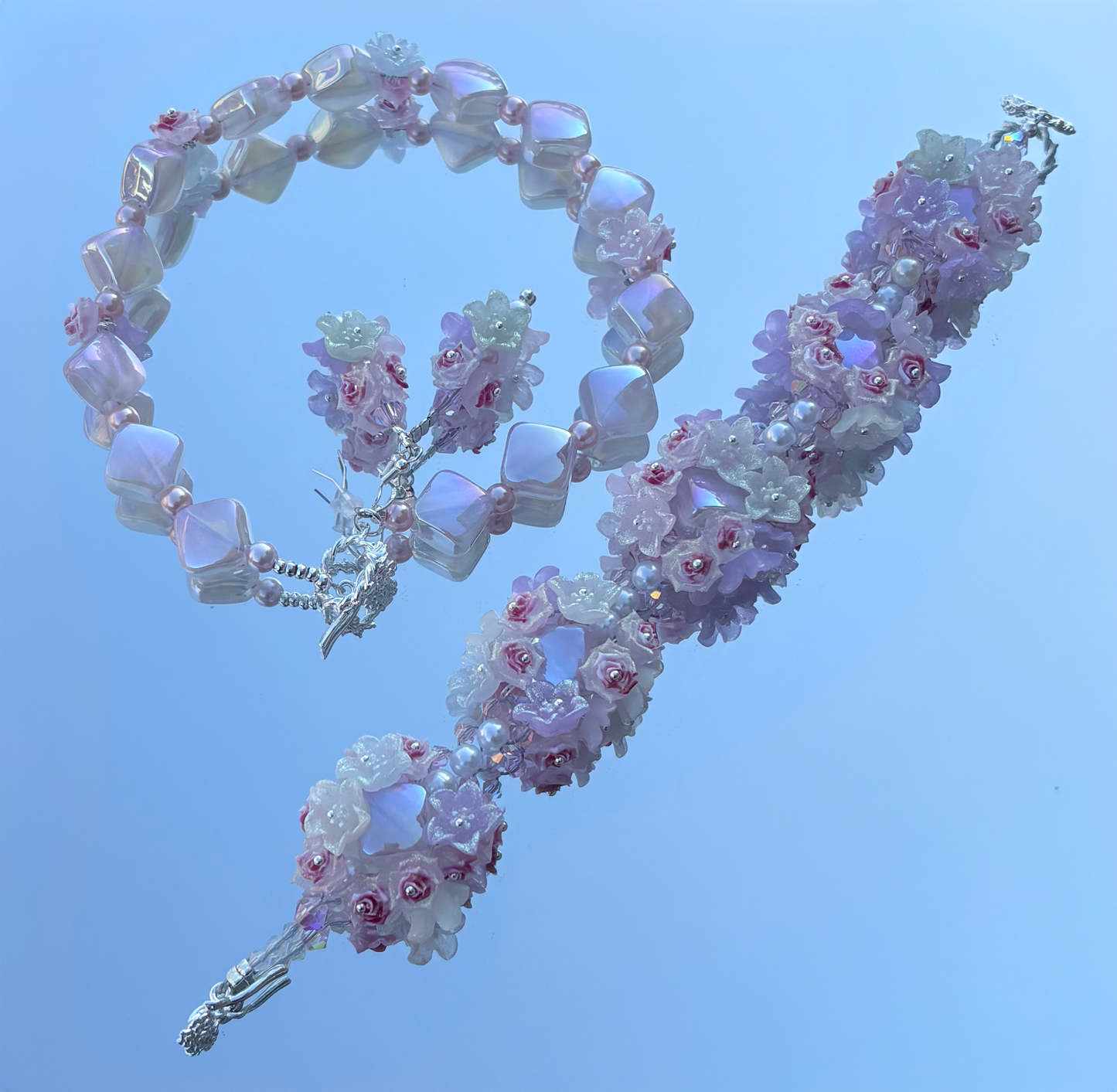 "Delicate flowers, fierce energy — this pastel set doesn’t whisper, it blooms with power. 🌸✨ #BigBeadEnergy"