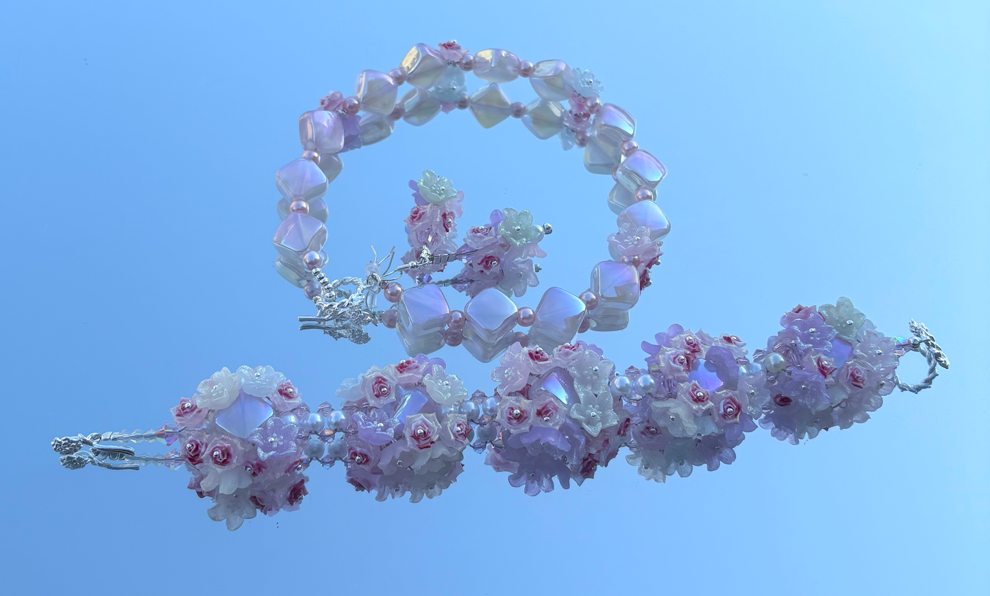 "Delicate flowers, fierce energy — this pastel set doesn’t whisper, it blooms with power. 🌸✨ #BigBeadEnergy"